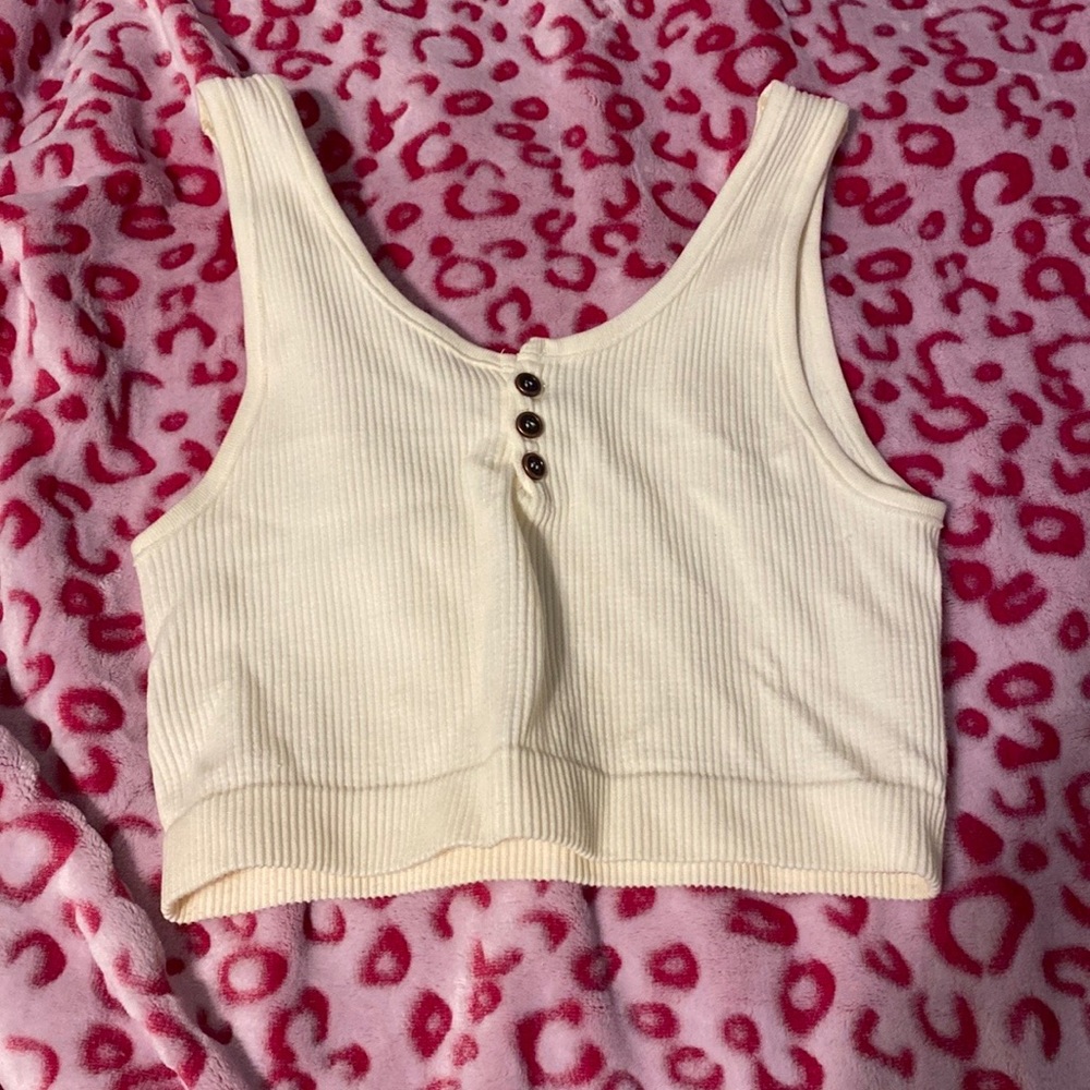 A medium sized cream tank top from By Together.